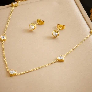 Set de joyería en acero inoxidable chapado en oro con colgante de corazón transparente y pendientes